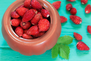 Fresh strawberries on green wooden background
