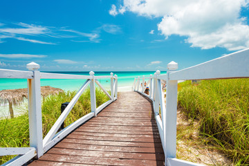 Walkway leading to a tropical beach in Cuba