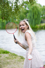 woman playing badminton