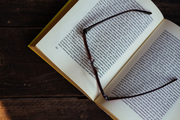 book on old wood with glasses