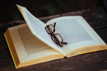 reading a book with glasses