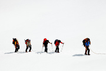 Team of alpinists crossing a glacier