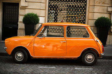 Retro car orange color purity in the street