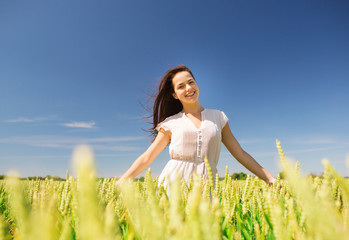 smiling young woman on cereal field