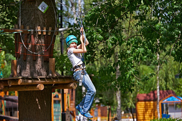 Girl is climbing on obstacle course