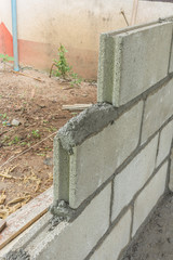 Brick laying, bricklaying spreading a bed joint. Bricklaying fou