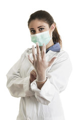 Young female doctor wearing gloves and mask