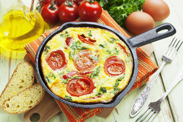 Omelet with vegetables and cheese. Frittata