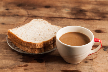 cup of coffee and Whole Wheat Bread.