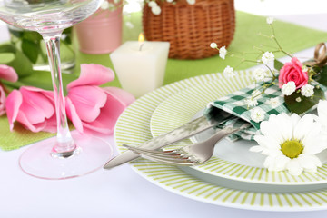Table setting with spring flowers close up