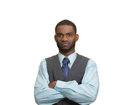 Portrait Grumpy, skeptical, displeased man, grey wall background