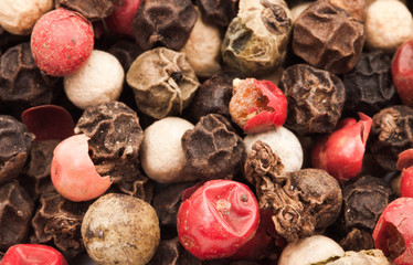 Raw Whole Four Peppercorn Blend against a background
