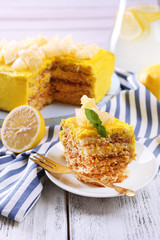 Tasty lemon dessert on wooden table