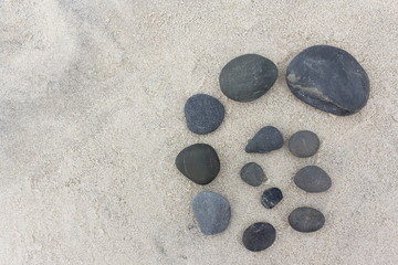 Fototapeta na wymiar Pebble Design on Sand 1