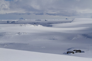 old scientific Antarctic station of snowy expanses of the Antarc