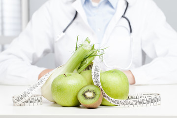 Nutritionist Doctor is writing a prescription. Focus on fruit - 68200344