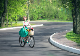 Spring walk. Romantic portrait of a girl with a bicycle