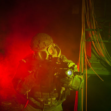 Special forces soldier with gas mask during the night mission