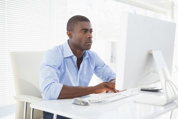 Fototapeta premium Focused businessman working at his desk