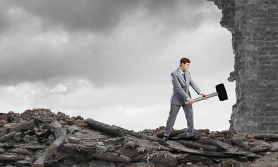 Businessman with hammer