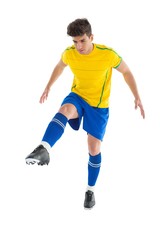 Fototapeta na wymiar Football player in yellow kicking