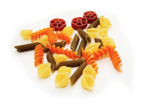 Different Flavored and Shaped Veggie Pasta Over White