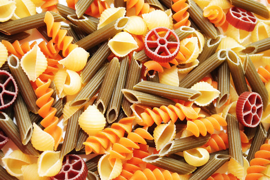 Background of Different Flavored Pasta Shapes