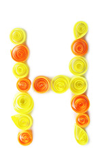 The letter "H" is made of quilling isolated on white