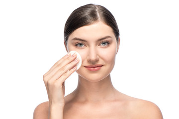 Fototapeta premium Beautiful woman removing facial make-up