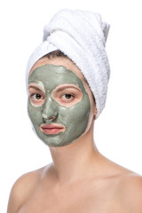 Beautiful woman with facial mask, isolated