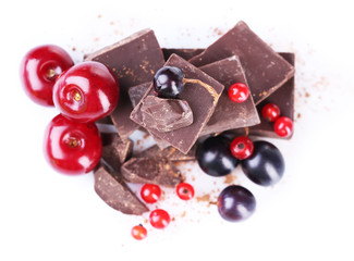 Summer berries and chopped chocolate isolated on white