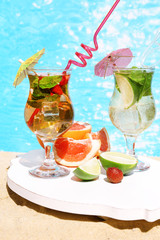 Delicious cocktails on beach, close-up