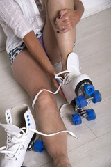 Woman removing quad skating boots