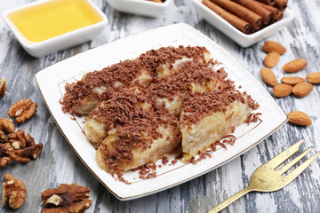 Sweetened fried banana on plate, close-up
