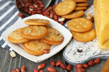 Cheese and crackers on wooden table close-up