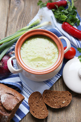 Leek soup on table, close up