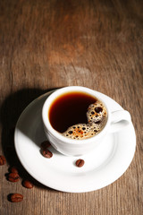 Cup of coffee on wooden background