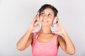 Naklejka premium Young Woman Listening Music with Headphones