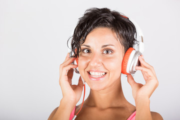 Naklejka premium Young Woman Listening Music with Headphones
