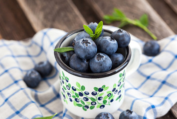 Fresh blueberry in the mug