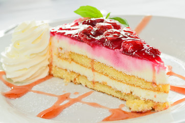Delicious strawberry cheesecake with whipped cream