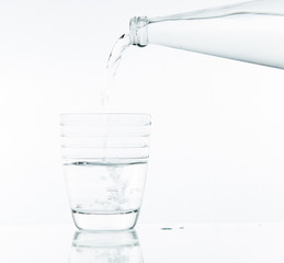 Pouring water on glass