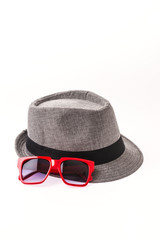 Hat , sunglasses isolated on white