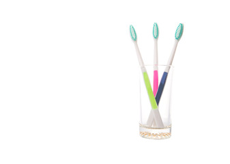 Tooth brush in a glass over white background 