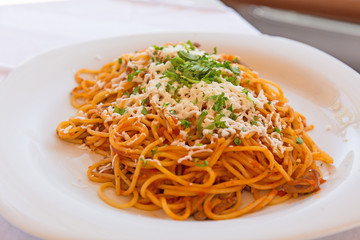  Vegetarian spaghetti with cheese on a white plate