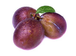 Ripe plum with leaf