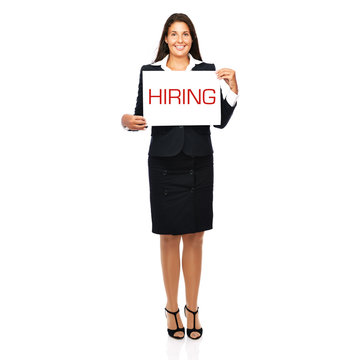 Business woman holding hiring sign in hands