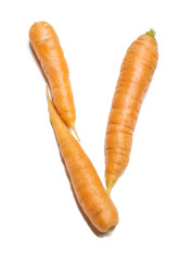 Alphabet letter V arranged from fresh carrots isolated