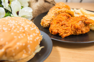 Fresh, fried chicken strips on a wooden table