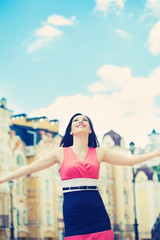 beautiful young woman posing on a city street